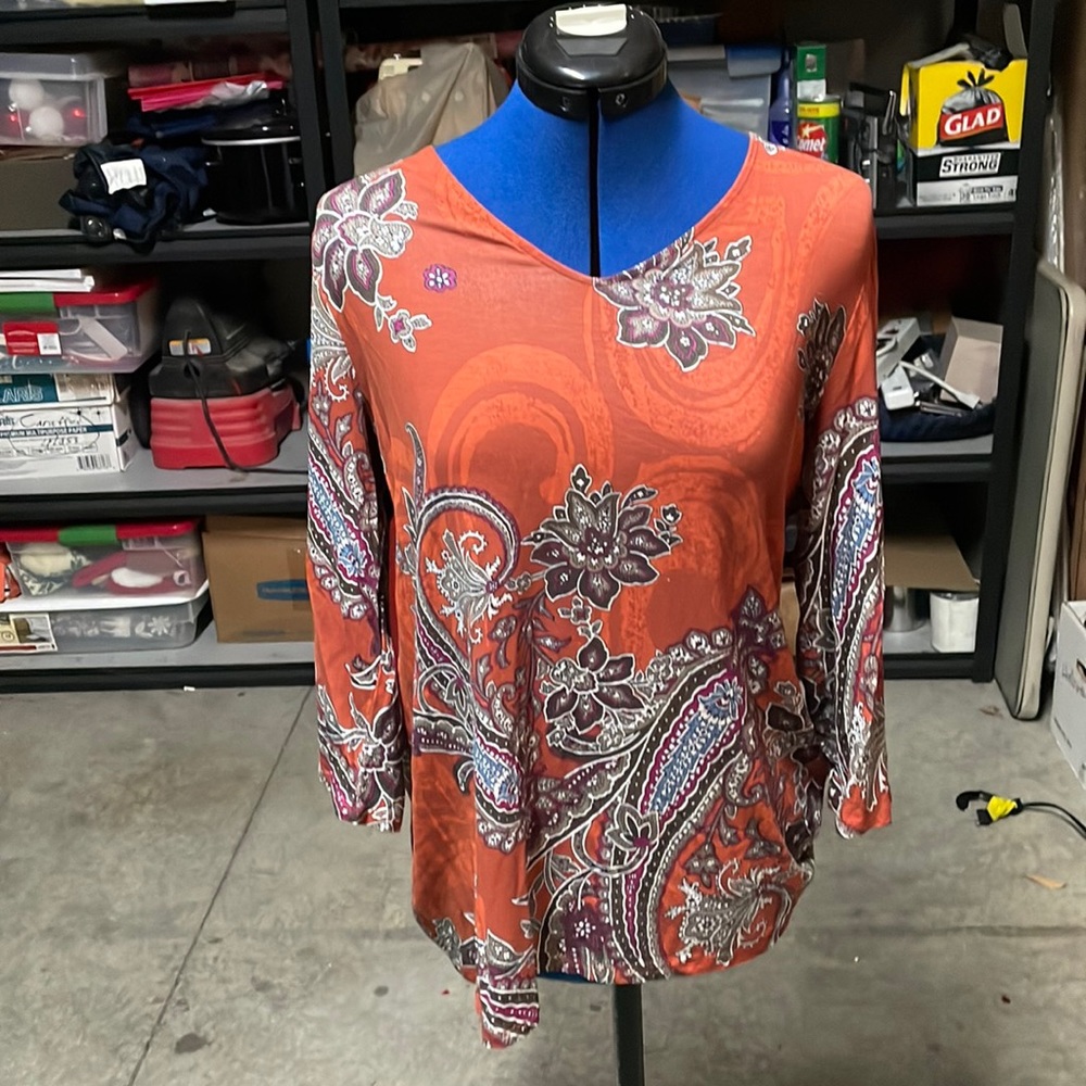 Chico’s orange shirt